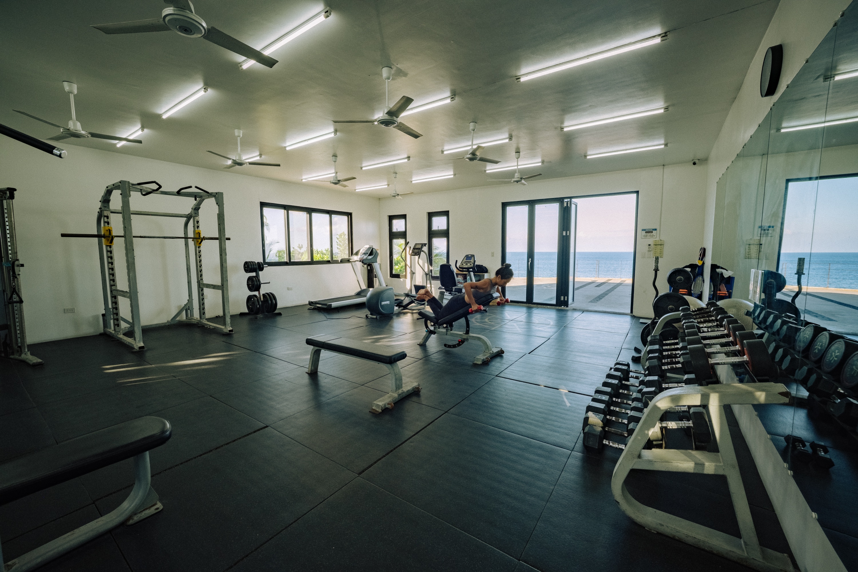 Ocean-view fitness center with cardio and strength equipment
