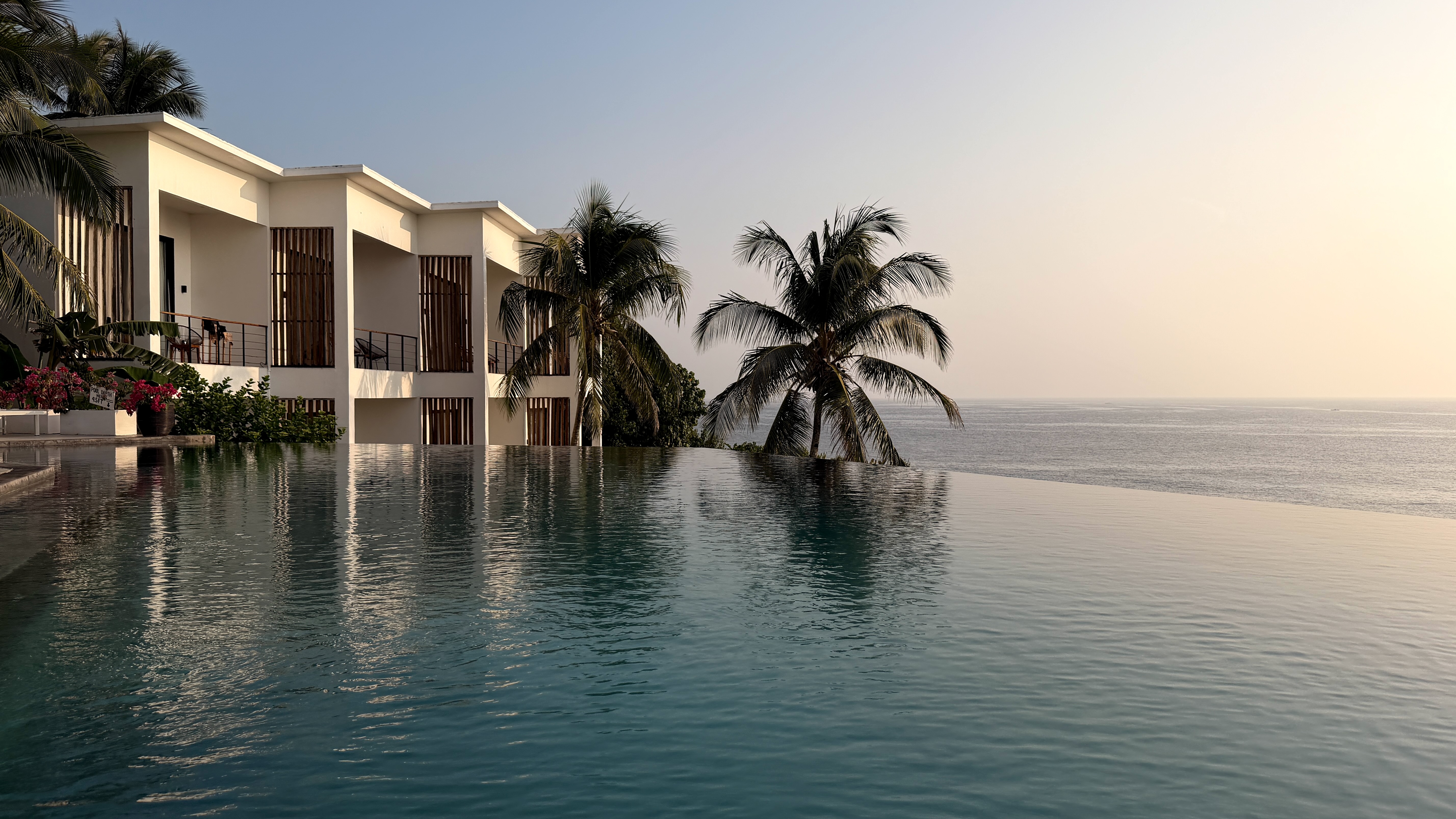 Infinity pool, guest-room wing and Pacific sunrise