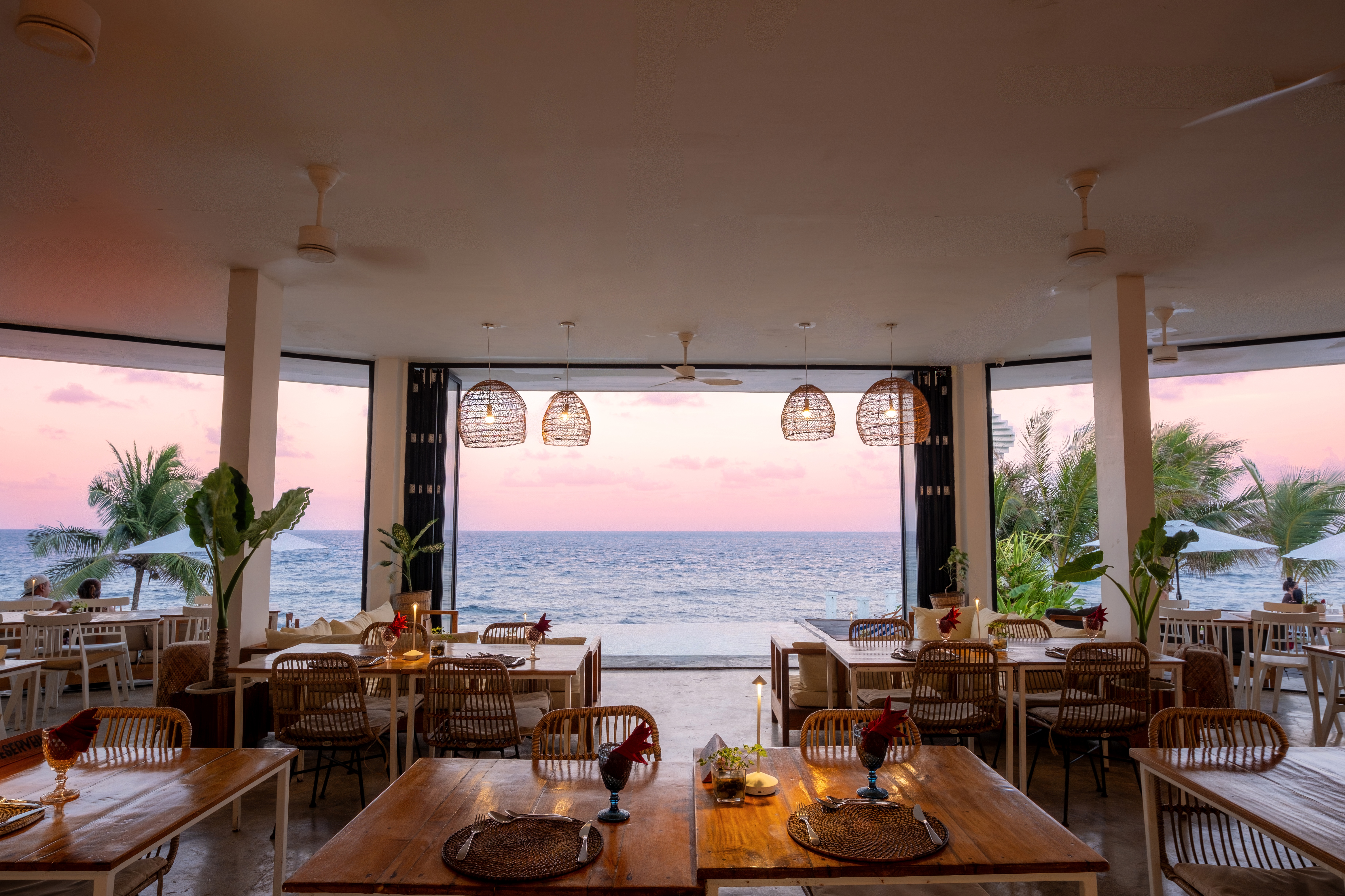 Oceanfront dining at sunset at Trogon’s Perch
