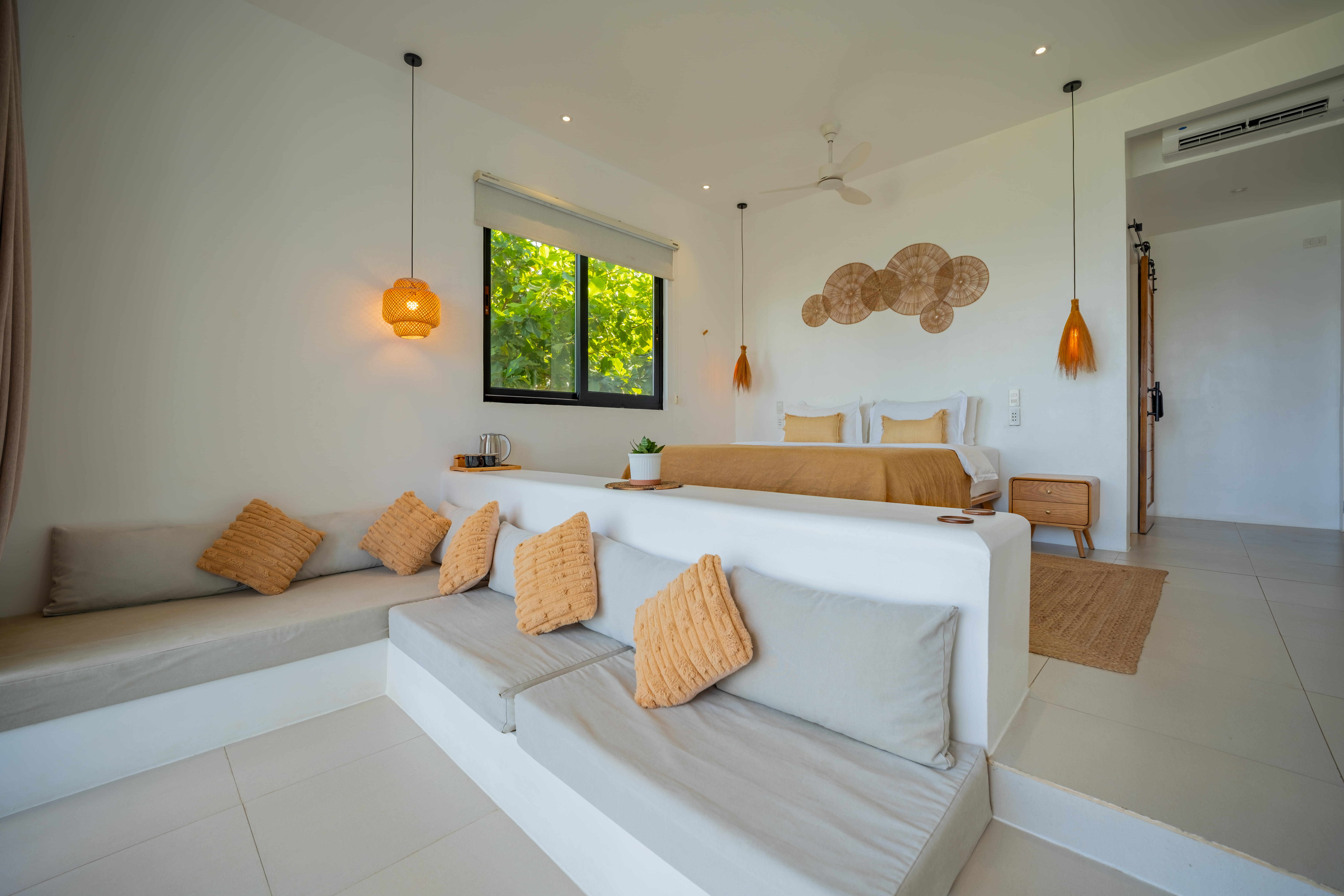 Deluxe Oceanfront Room lounge, sofa and king bed